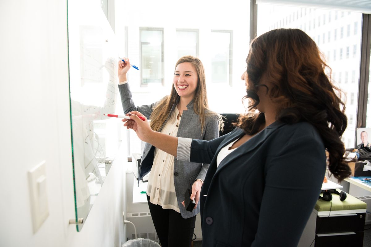 A coaching session at a whiteboard